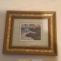 Overall view of the framed artwork titled "Peggy's Delight" with an ornate gold frame and scenic coastal image.