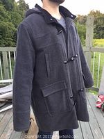 Image showing a man wearing a grey London Fog car coat, size 2X, featuring toggle fasteners, flap pockets, and a hood.
