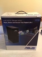 Front view of Asus TS Mini Series Home Server retail box with 500 GB branding and no hard drive note written on top