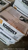 Photo showing stacked cardboard boxes labeled Ecobust Type 2 with partial instructions visible.