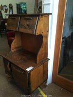 Image showing the wooden cabinet with two top doors labeled 'CRACKERS' and 'BREAD' and two bottom doors.