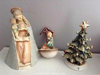 Three porcelain figurines: Flower Madonna Hummel TMK 3SS, Praying Boy Water TMK 3, and Capodimonte Christmas tree