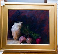 Front view of framed oil painting depicting a clay vase and root vegetables
