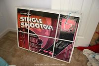 Full view of the Harvard Single Shootout electronic basketball game in original box resting on carpeted floor.