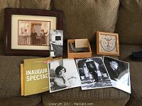 Overview of the lot showing framed photo of Pope and President Carter, Life magazine, signed Jackie photo, two Kennedy family photos, Navajo art box.