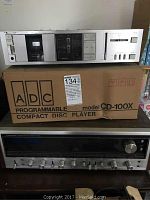 Front view showing Nakamichi BX-1 cassette deck on top of ADC CD-100X box above Pioneer SX-939 stereo receiver