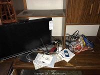 Desk setup showing monitor, keyboard, cables and accessories around Mac Mini