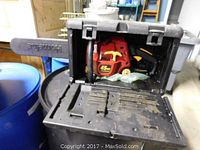 Homelite 45cc chain saw in black carrying case showing front and blade guard with Homelite branding.