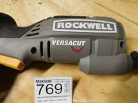 Close-up side view of the main body showing Rockwell Versacut branding on the grey plastic housing without visible wear.