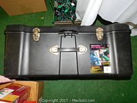 Front view of the black CONTICO Deluxe Wheeled Locker showing metal latches, plastic handle, and product label.