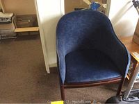 Front view of one blue ultra suede tub chair showing overall shape and upholstery