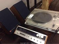 Front view showing JBL speakers on stands beside Sherwood receiver and JVC turntable