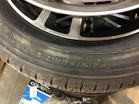 Close-up of sidewall showing P215/60R17 size marking and tread pattern