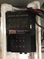 Front view of Megga Sound speaker box amplifier showing control knobs and power switch.