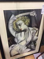 Frontal view of framed drawing showing subject and broken glass