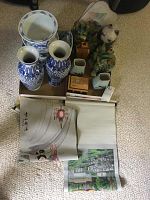 Lot overview with blue and white vases, planters, ceramic lions, fabric wall hangings