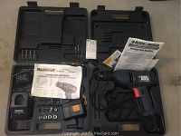 Full view of carrying case with both drills, manuals, charger, and drill bits