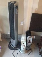 Front view of Airworks and Bellagio portable heaters next to Seville standing fan