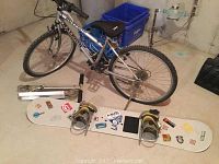 Raleigh Hotfoot bike with 24 inch frame and 20 inch wheels, along with 58 inch snowboard and silver scooter in background.