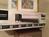 Front of box showing Sony logo, product image, and sound bar with subwoofer illustration