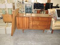 Front view of dresser with mirror leaning against side