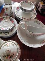 Floral patterned china bowls, plates, tea cups, saucers with Cordon Bleu gravy boat and bowl