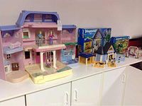 Full view of doll house, Playmobil Animal Clinic buildings, accessories, and boxed sets