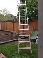 Full-length view of the aluminum A-frame ladder standing in yard