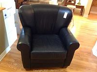 Front view of black leather armchair