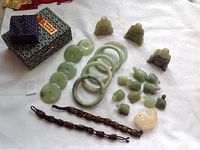 Overhead view of all jade and wooden items arranged on surface