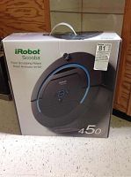 Front of sealed box showing iRobot Scooba branding and model number