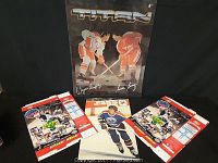 Two unopened Upper Deck hockey card boxes, a Wayne Gretzky signed-style poster, and four individual hockey player cards laid out for display