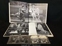 Vintage Marilyn Monroe photo book opened showing classic black and white images.