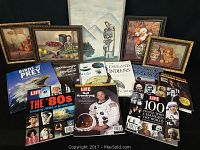 Collection of framed art prints along with nature-themed books and four Life magazines arranged on a dark background.