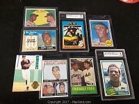 Front view of the 7 vintage MLB baseball cards showing players Hank Aaron, Reggie Jackson, Ed Mathews, Rodriguez, Sandy Koufax, Jim Maloney, Don Drysdale, and Rickey Henderson along with a Friendly Foes card.