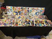 Row of 24 Marvel X-Force comic books displayed showing full front covers.