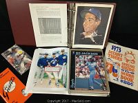 Photo of binder photobook open showing Dodgers player portraits, Bo Jackson photo sleeve, 1973 Detroit Tigers program, and baseball cards