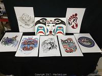 Nine Native artwork prints by Hubert Billy displayed against a black backdrop, showing various detailed Indigenous designs with animals, faces, and footprints.