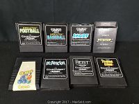 Eight vintage video game cartridges for ColecoVision and Adam systems shown side by side.