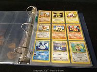 Photo showing Pokemon cards arranged in plastic sleeves in a binder, including Pidgeotto, Seadra, Farfetch'd, and Hitmonchan