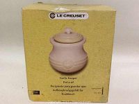 Le Creuset garlic keeper box showing product image and branding, indicating it is new and unopened.