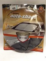 Photo of folded Auto Expression Platinum Auto Shade in original packaging with size and cooling info visible.