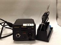 Zimtown YiHua 937D soldering station showing the main unit with control knob and digital display, soldering iron placed in its stand, with all cables intact.