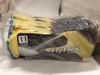Ten pairs of yellow Ansell HyFlex 11-500 gloves packed together, size 11