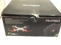 Box of Akaso quadcopter drone with product details printed and image of drone and camera lens on the box.