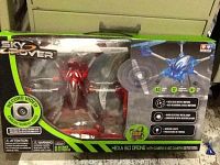 Photo of boxed Sky Rover HEXA 6.0 Drone with video camera, showing front of retail packaging and product.