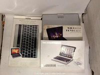 Photo of four boxed Bluetooth tablet keyboards, showing packaging and branding for Samsung Galaxy Tab 10.1 and iPad Mini compatible keyboards.