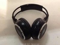 Close-up image of a single black infrared wireless headphone showing padded ear cups, adjustable headband, control buttons, and charging port.