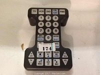 Front view of Tek Partner large universal remote control showing all buttons and labels.