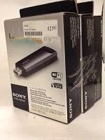 Sony Wireless LAN Adapter UWA-BR100 in original box, showing front and side details of packaging.
